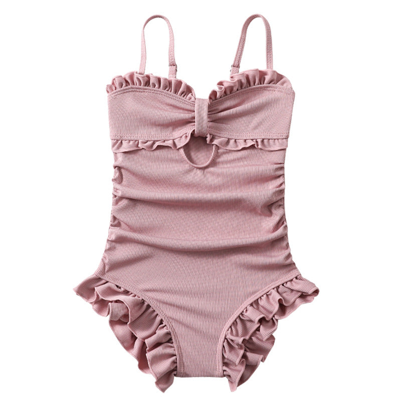 The suspender one-piece swimsuit is cute and playful