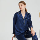 Navy blue long-sleeve silk pajama top with contrasting white piping