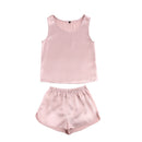 Flat lay of lotus pink silk tank and shorts set