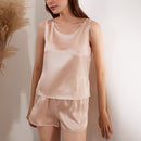 Front view of light apricot silk pajama set with pampas grass decor