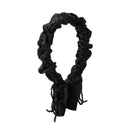 Side angle showing pleated texture and curved silhouette of black headband