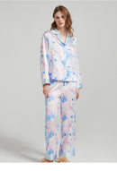 Silk pajama shirt laid flat displaying the full watercolor design and button front