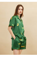 Back pocket detail on dark green silk shorts