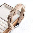 Front view of black pearl headband on white background