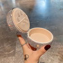 Side profile of compact jewelry box highlighting slim dimensions and matte finish