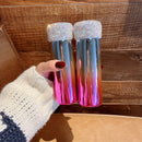 Top-down shot of two rainbow tumblers side by side showing vibrant color shift