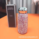 Side profile of Nordic pink tumbler showing crystal band and matte stainless steel finish