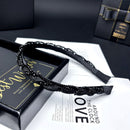 Close-up detail of starlight beadwork and embroidery texture on black headband