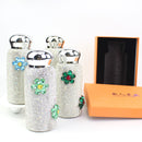 Tumbler placed beside coffee cup and notebook on wooden desk — lifestyle shot