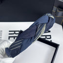 Close-up of textured braided detail on navy headband