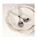 Set displayed in open gift box with tissue paper and branded tag