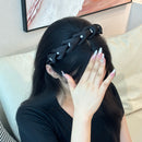 Side angle showing high-crown curve and wide band structure