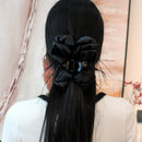 Side profile showing 13 cm shark clip mechanism and layered satin bow structure