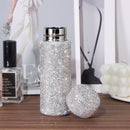Close-up of crystal accents on white tumbler exterior