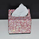 Tissue box holder placed beside ceramic mug and open book on wooden side table