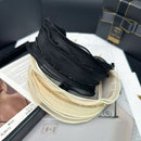 Close-up detail of hand-set crystals on fine mesh base