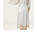 Back detail showing sheer silk yoke and lace cuffs