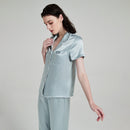Side profile view of silk pajama top showing fit and drape