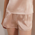 Light apricot silk sleep shorts front view on model