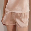 Back view of light apricot silk shorts with elastic waistband