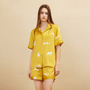Back view of gold silk pajama set showing relaxed fit