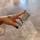 Refilled bottle with amber-toned facial mist visible through translucent PP body