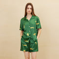 Dark green leopard print silk pajama set front view on white background