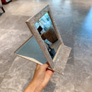 Mirror unfolded at 90-degree angle demonstrating stable tabletop positioning