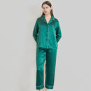 Dark green mulberry silk pajamas displayed flat