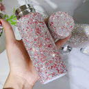 Front view of pink diamond-accented mini stainless steel tumbler on clean white background