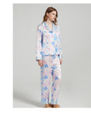Silk pajama pants laid flat showing the full-length cut and print