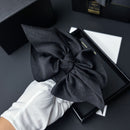 Side angle of black claw clip showing tapered shark-inspired jaw contour