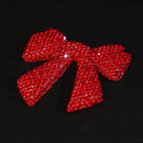 Blue bow charm emphasizing cool-toned brilliance