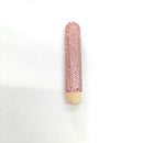 Wooden makeup brush handles in rose red and white AB arranged diagonally for lifestyle context