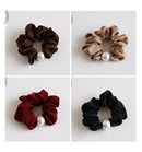 Flat lay of all four colors arranged in a soft gradient