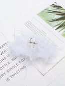 Clip styled with curtain bangs and silk scarf for elevated casual look