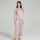 Sweet lotus pink silk pajama set styled with fuzzy slippers