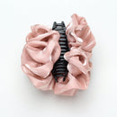 Lavender cloud clip secured in a loose low chignon