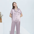 Lavender purple silk pajama set in relaxed loungewear pose