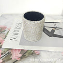 Multicolor version of round leather desk organizer with assorted brushes inside