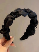 Detail of satin texture and secure metal butterfly mounting point