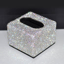 Top-down shot of square tissue box holder with standard tissue box inserted