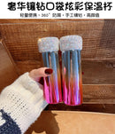 Tumbler filled with iced water and condensation visible on exterior