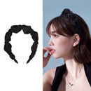 Side angle showing sculptural butterfly detail and crystal accents