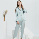 Mint green silk pajama set in full-length cut on standing model