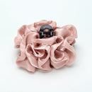 Tulle cloud clip resting on marble surface with soft shadow