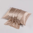 Champagne silk pillowcase displaying the warm golden tone and silky drape