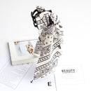 Black cashew scrunchie tied in half-up hairstyle natural lighting