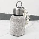 Pearl-embellished insulated tumbler in Moonlight White on white background, front view