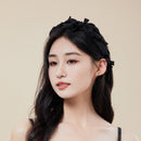 Side profile showing ruffled texture and band curvature